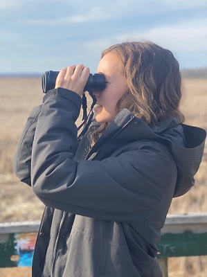Woman with binoculars.
