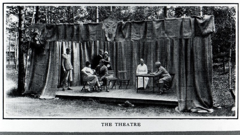 Vintage photo of stage and actors.