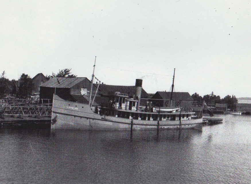 Vintage photo of a ship at a dock. 