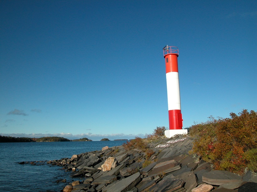 Lighthouse on a rocky point.