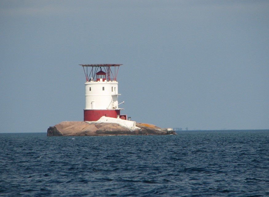A lighthouse on a rocky island.