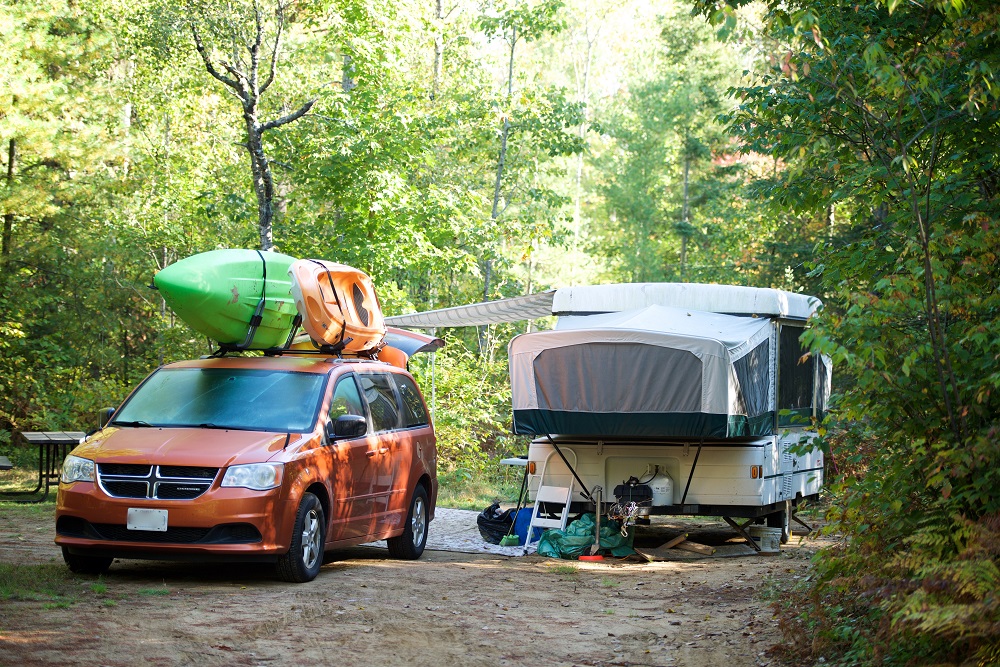 campsite with trailer and van