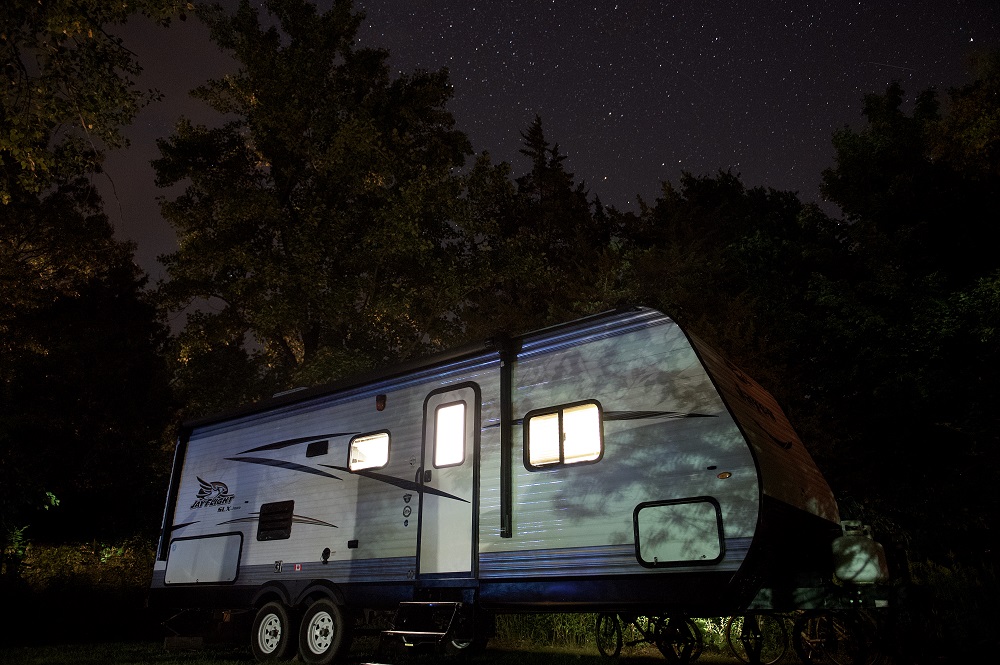 RV at night with stars in sky