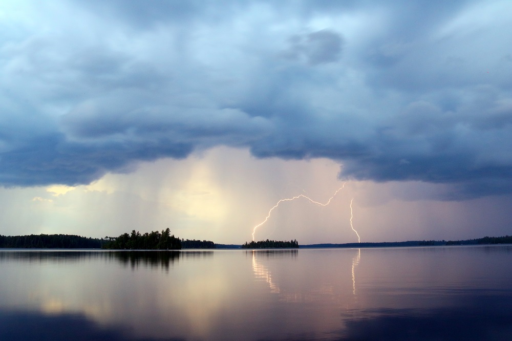 lightning striking on lake