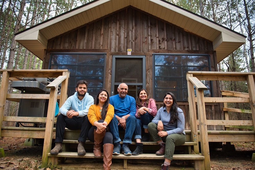 family outside of cabin