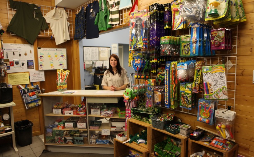 A park store employee behind the counter of a park store