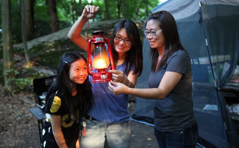 family looking at lantern