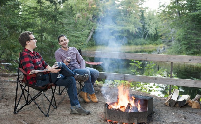 couple relaxing by campfire