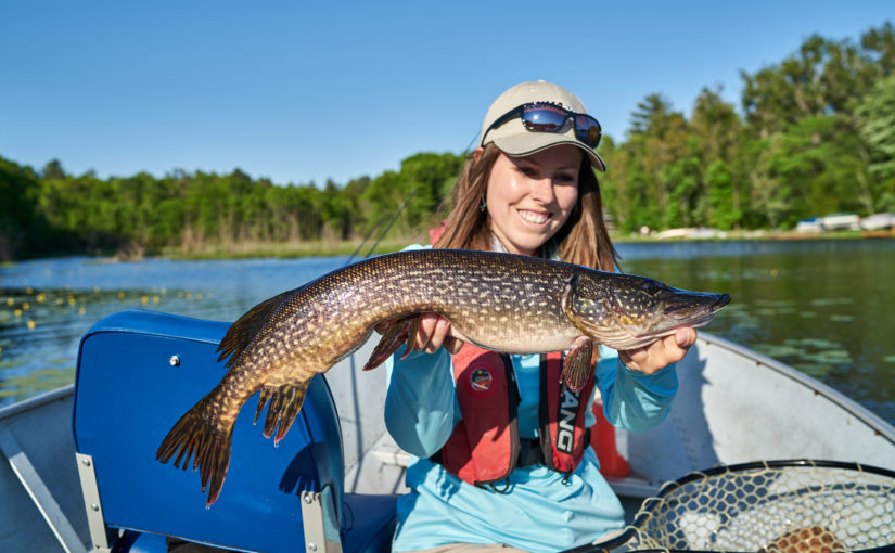 Ashley Rae holding a large fish.