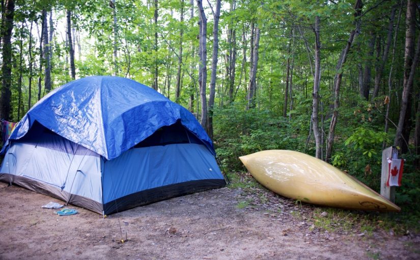 campsite with tent and canoe