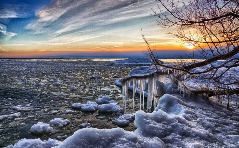 Icy shoreline at sunset